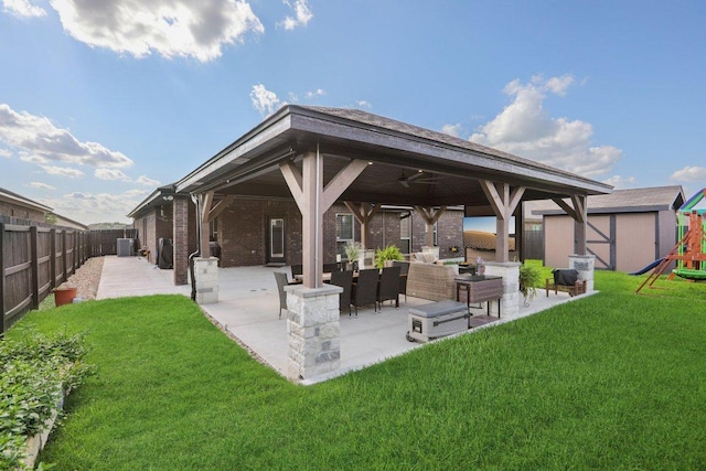 5106 La Piedra Ln, Killeen, TX 76549 - rear view of property featuring a playground, a patio, a fenced backyard, and ceiling fan
