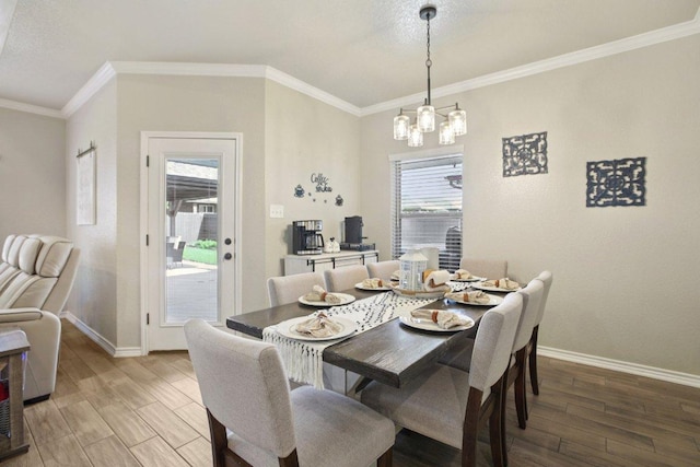 5106 La Piedra Ln, Killeen, TX 76549 - dining room featuring a chandelier, light wood-style flooring, and crown molding