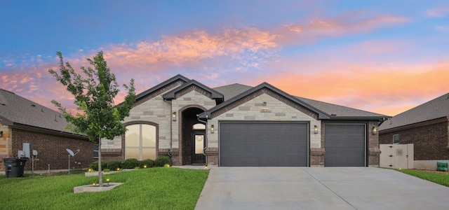 5106 La Piedra Ln, Killeen, TX 76549 - french provincial home with driveway, a garage, a lawn, and stone siding