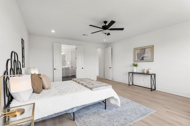5316 Bellano Bnd, Leander, TX 78641 - bedroom with wood finished floors, recessed lighting, ensuite bathroom, and ceiling fan