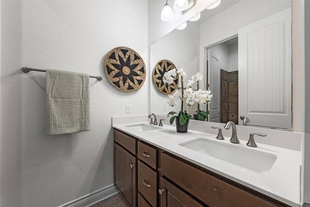 105 Quiet Oak Cv, Liberty Hill, TX 78642 - full bath with double vanity and baseboards
