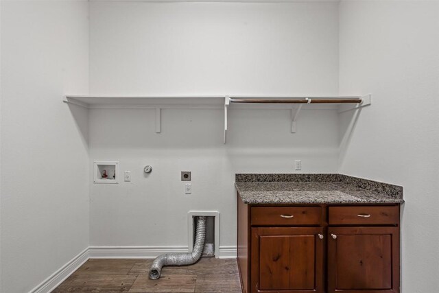 105 Quiet Oak Cv, Liberty Hill, TX 78642 - laundry area featuring hookup for an electric dryer, hookup for a gas dryer, dark wood finished floors, washer hookup, and cabinet space