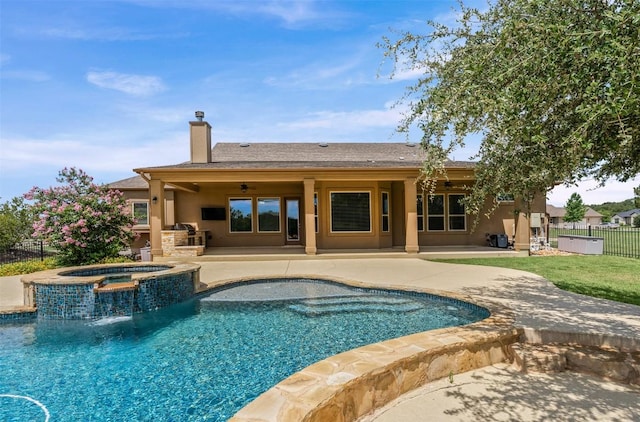 105 Quiet Oak Cv, Liberty Hill, TX 78642 - view of swimming pool featuring a patio area, an outdoor kitchen, and a pool with connected hot tub