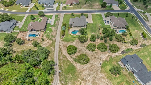 105 Quiet Oak Cv, Liberty Hill, TX 78642 - view of property location with a pool and nearby suburban area