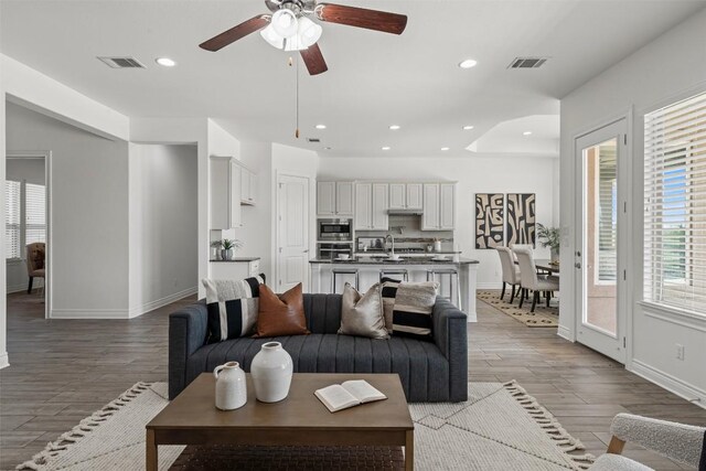 105 Quiet Oak Cv, Liberty Hill, TX 78642 - living room with wood finished floors, ceiling fan, and recessed lighting