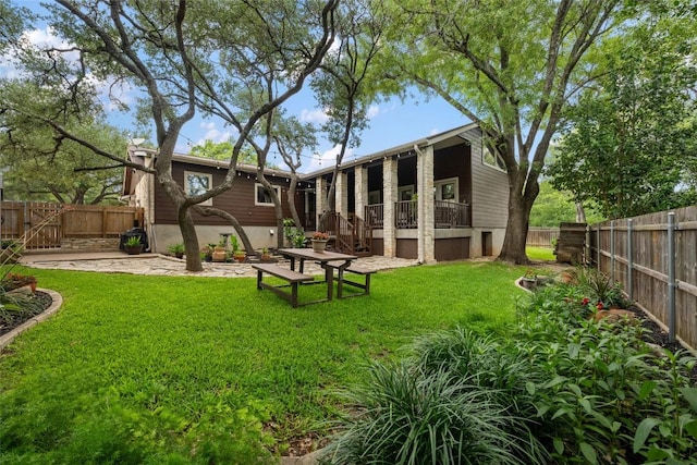 1501 Johnny Miller Trl, Austin, TX 78746 - back of property with a fenced backyard and stairway