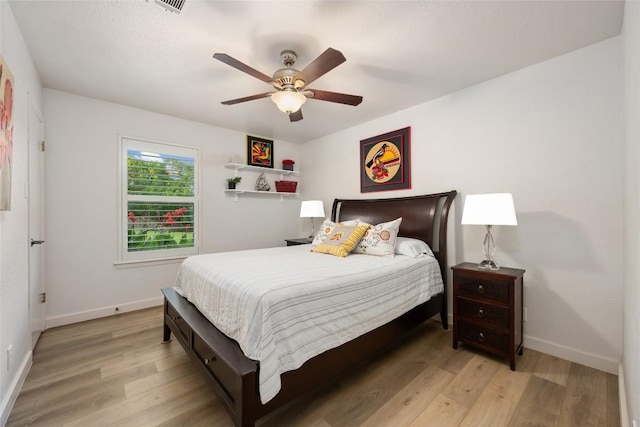 1501 Johnny Miller Trl, Austin, TX 78746 - bedroom featuring light wood-style floors and ceiling fan