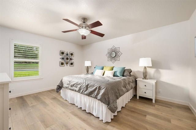 1501 Johnny Miller Trl, Austin, TX 78746 - bedroom featuring light wood-style flooring and a ceiling fan