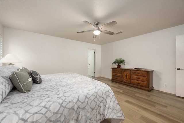 1501 Johnny Miller Trl, Austin, TX 78746 - bedroom with wood finished floors and a ceiling fan