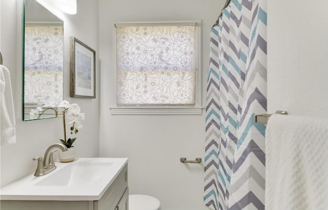 504 Denson Dr, Austin, TX 78752 - full bathroom with vanity and healthy amount of natural light