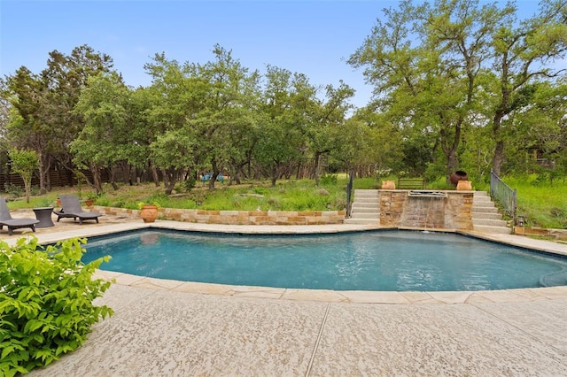 5308 Great Divide Dr, Bee Cave, TX 78738 - swimming pool featuring stairway, view of scattered trees, and a patio area
