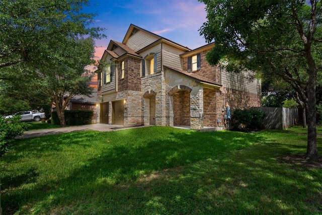 2003 Woodway Dr, Leander, TX 78641 - view of front of property featuring stone siding, driveway, and an attached garage