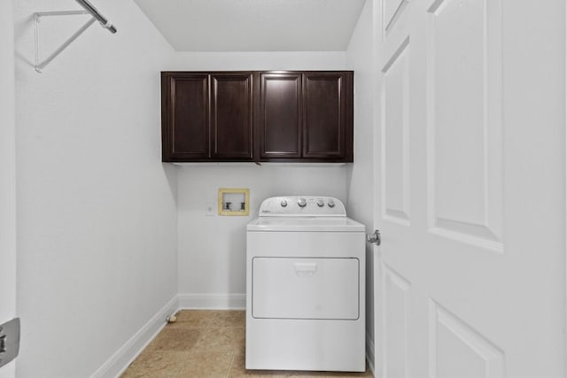 2003 Woodway Dr, Leander, TX 78641 - laundry room with washer / clothes dryer, cabinet space, and light tile patterned floors
