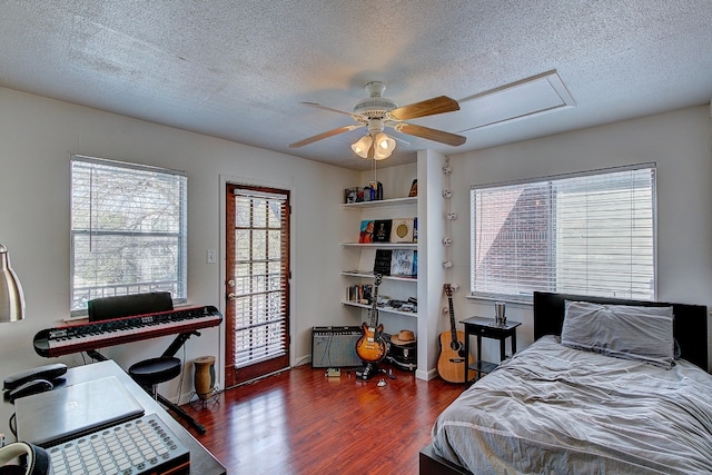 1010 W 23rd St Unit 2, Austin, TX 78705 - bedroom featuring wood finished floors, a textured ceiling, ceiling fan, and access to outside