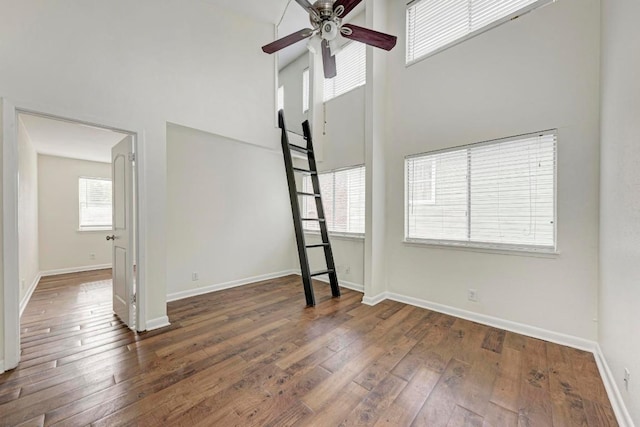 1010 W 23rd St Unit 2, Austin, TX 78705 - unfurnished room featuring ceiling fan, a high ceiling, and hardwood / wood-style floors
