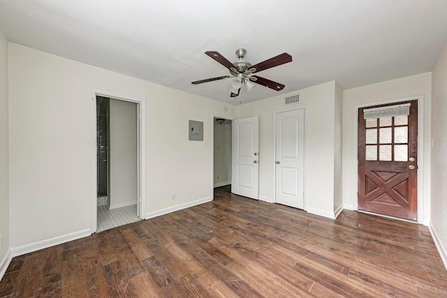1010 W 23rd St Unit 2, Austin, TX 78705 - unfurnished bedroom with wood finished floors, electric panel, a ceiling fan, and connected bathroom