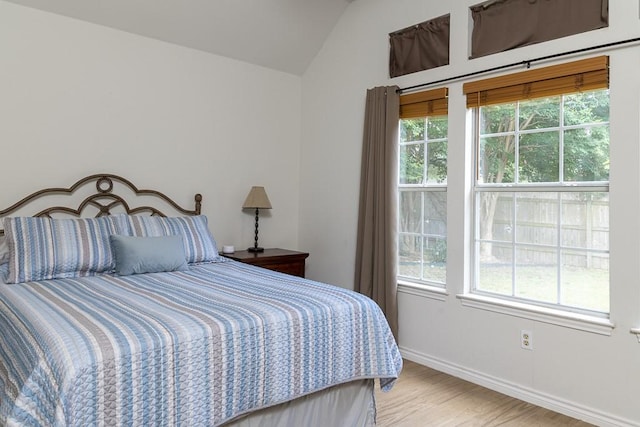 1805 Sequoia Dr, Leander, TX 78641 - bedroom with multiple windows, lofted ceiling, and wood finished floors