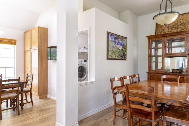 1805 Sequoia Dr, Leander, TX 78641 - dining area with washer / clothes dryer, light wood finished floors, and lofted ceiling