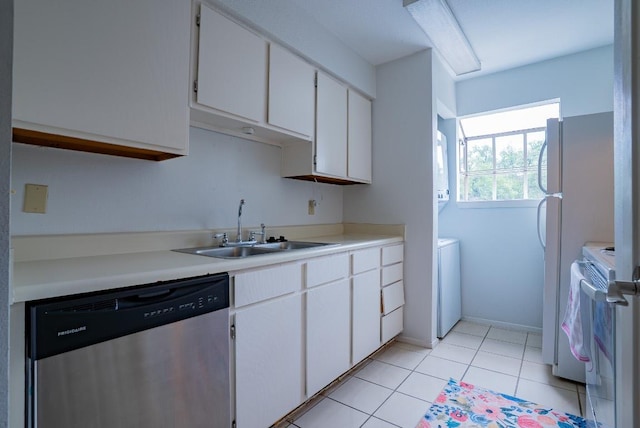 6903 Deatonhill Dr Unit 19, Austin, TX 78745 - kitchen with dishwasher, white range with electric cooktop, white cabinets, light countertops, and light tile patterned floors
