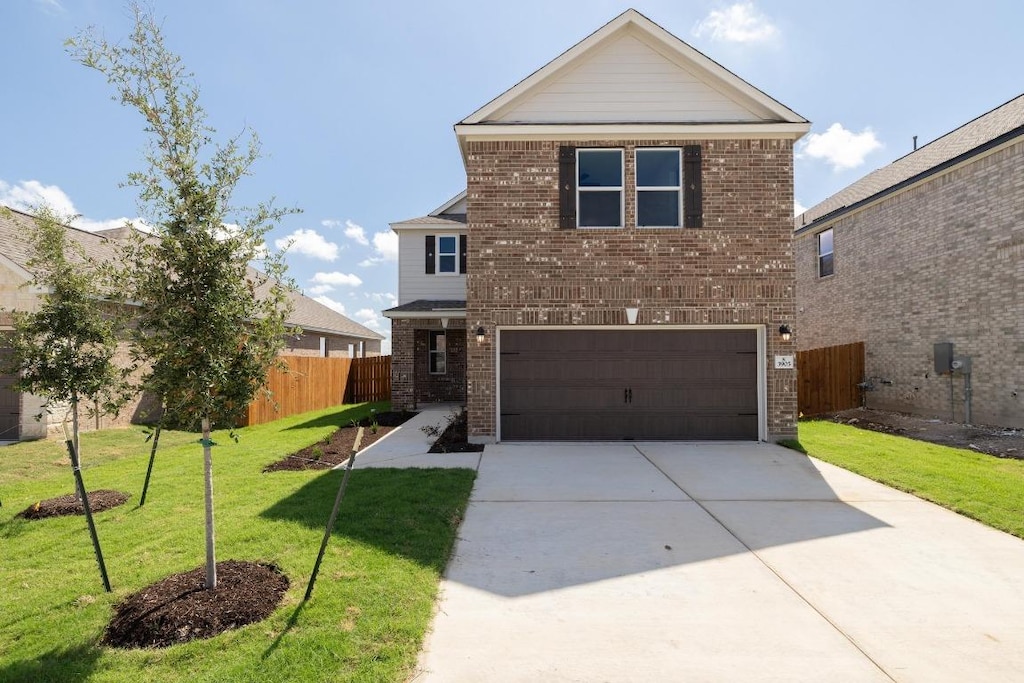 3905 Pinto Ln, Round Rock, TX 78665 - traditional-style house with brick siding, an attached garage, and concrete driveway