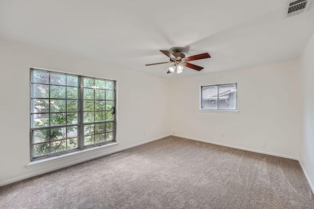 9504 Hansford Dr, Austin, TX 78753 - carpeted empty room with plenty of natural light and a ceiling fan