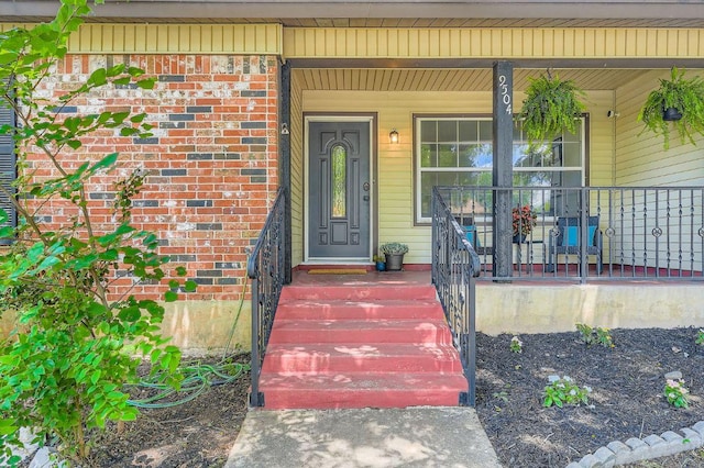 9504 Hansford Dr, Austin, TX 78753 - view of exterior entry with a porch