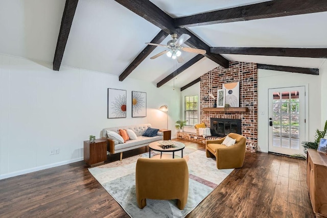 9504 Hansford Dr, Austin, TX 78753 - living room featuring wood finished floors, a ceiling fan, plenty of natural light, and a brick fireplace