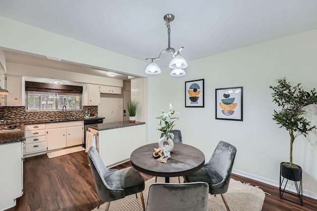 9504 Hansford Dr, Austin, TX 78753 - dining space featuring a chandelier and dark wood finished floors