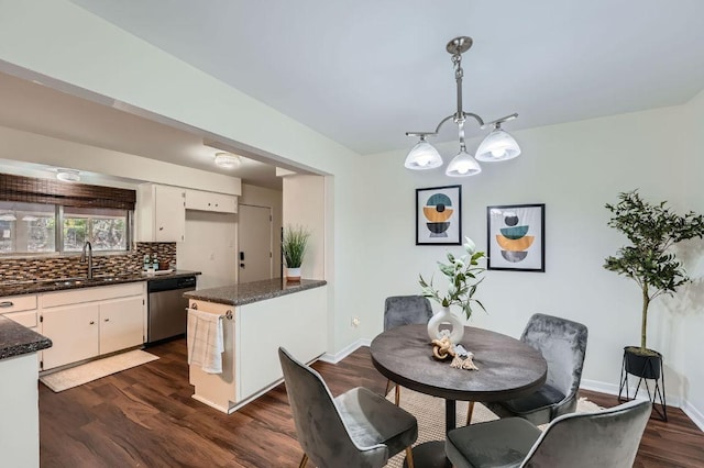 9504 Hansford Dr, Austin, TX 78753 - dining area with dark wood-style floors and baseboards