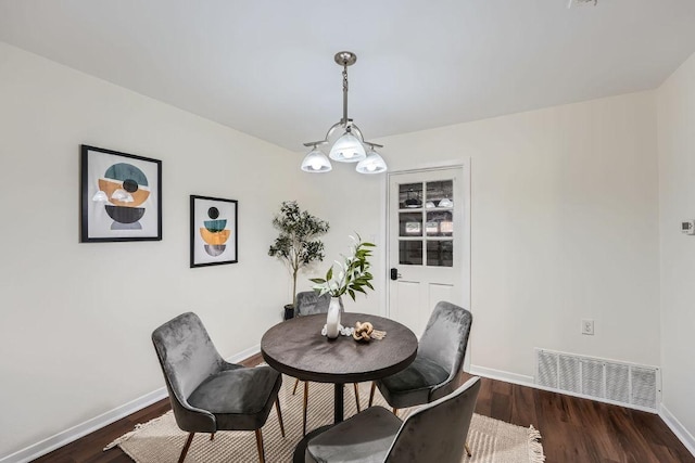 9504 Hansford Dr, Austin, TX 78753 - dining area with baseboards and dark wood-style floors