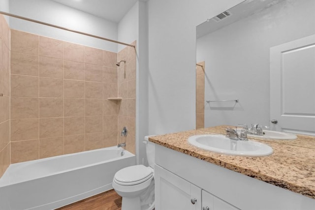 2961 Brogan Crk, New Braunfels, TX 78130 - bathroom with vanity, wood finished floors, and bathing tub / shower combination