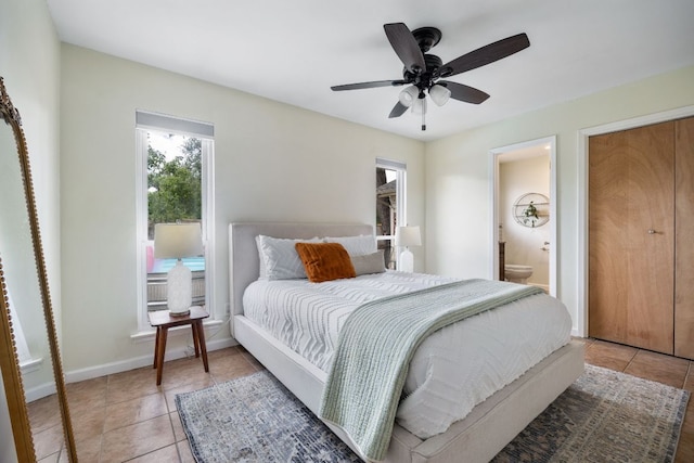 1406 Radam Cir, Austin, TX 78745 - bedroom with light tile patterned floors, ensuite bathroom, and ceiling fan