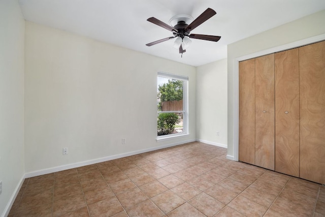 1406 Radam Cir, Austin, TX 78745 - unfurnished bedroom featuring light tile patterned flooring, a closet, and ceiling fan