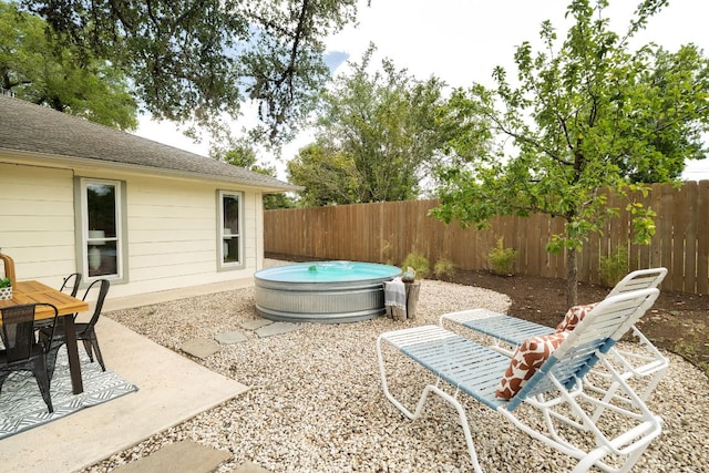 1406 Radam Cir, Austin, TX 78745 - fenced backyard featuring a patio and outdoor dining area