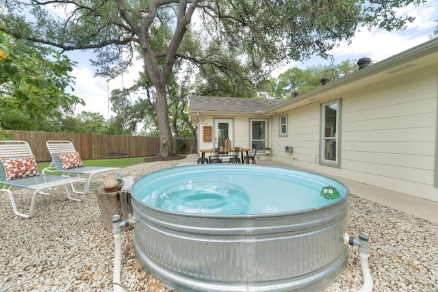 1406 Radam Cir, Austin, TX 78745 - view of pool with a fenced backyard and a hot tub