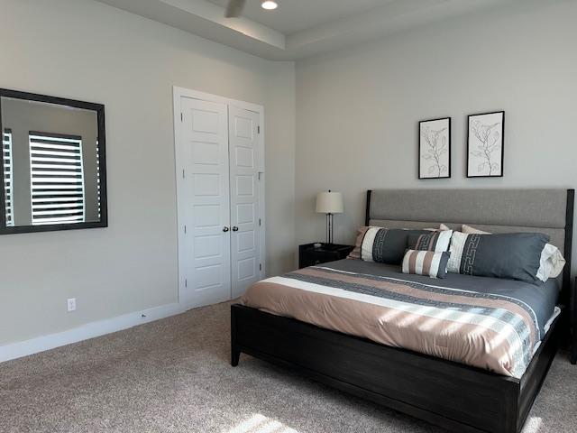 900 Elenora Dr, Leander, TX 78641 - carpeted bedroom featuring a closet and recessed lighting