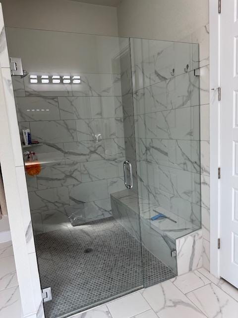 900 Elenora Dr, Leander, TX 78641 - bathroom featuring a marble finish shower and marble look tile flooring