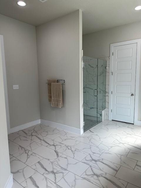 900 Elenora Dr, Leander, TX 78641 - bathroom featuring recessed lighting, a marble finish shower, and marble finish floors