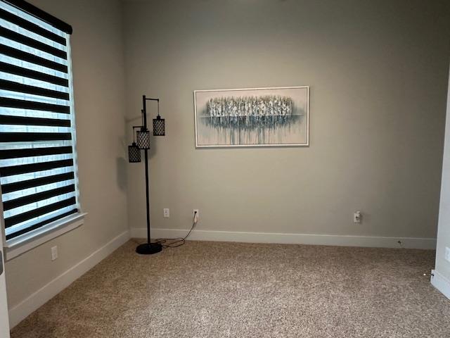 900 Elenora Dr, Leander, TX 78641 - carpeted spare room with baseboards