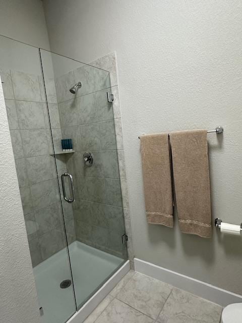 900 Elenora Dr, Leander, TX 78641 - full bathroom with tile patterned flooring and a shower stall