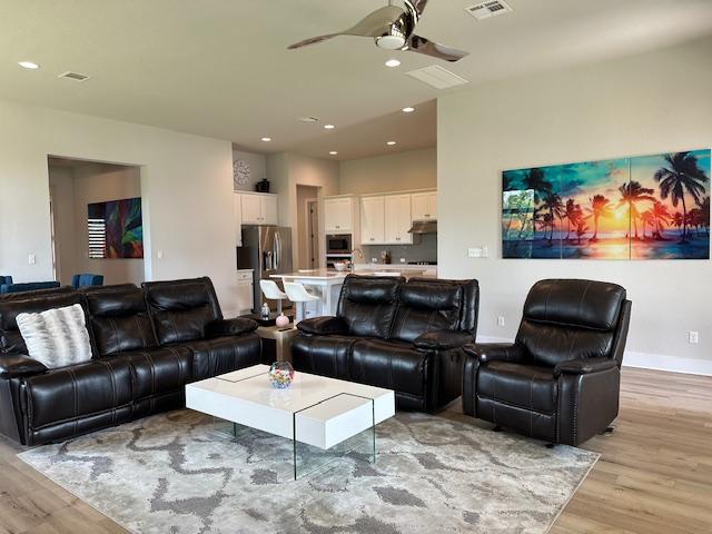 900 Elenora Dr, Leander, TX 78641 - living area with light wood-style floors, a ceiling fan, and recessed lighting