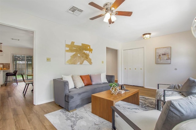 4504 Bilboa Dr, Austin, TX 78759 - living room with light wood finished floors and ceiling fan