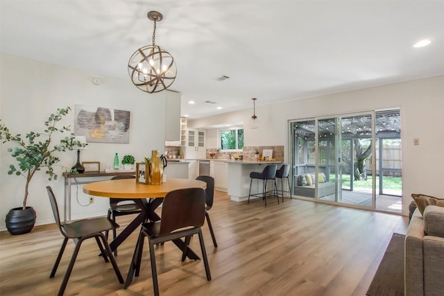 4504 Bilboa Dr, Austin, TX 78759 - dining area with light wood-style floors, a chandelier, and recessed lighting