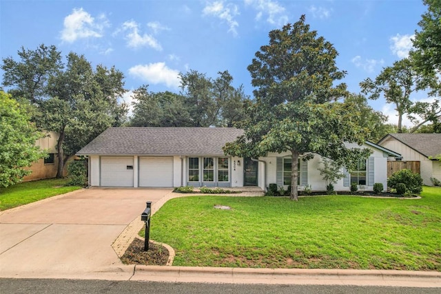 4504 Bilboa Dr, Austin, TX 78759 - view of front of property with an attached garage, driveway, and a front yard
