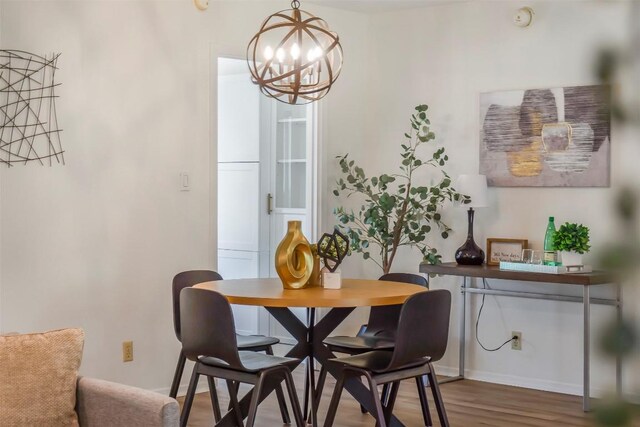 4504 Bilboa Dr, Austin, TX 78759 - dining space with a chandelier and wood finished floors