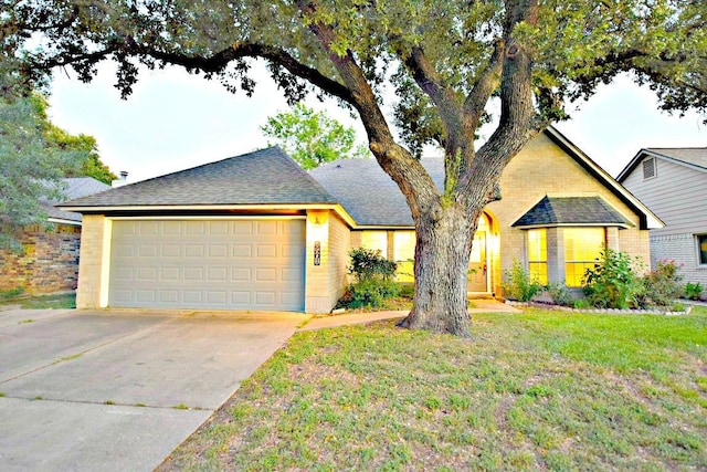 8501 Priest River Dr, Round Rock, TX 78681 - ranch-style home featuring a garage, roof with shingles, a front yard, and brick siding