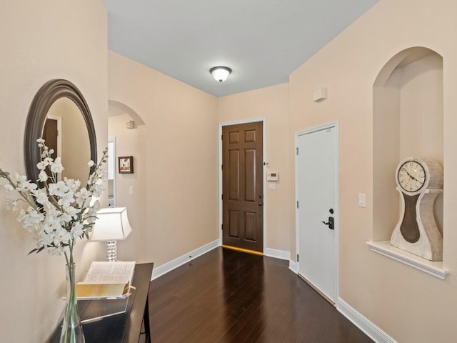 2520 Butler National Dr, Pflugerville, TX 78660 - foyer entrance with wood finished floors and arched walkways
