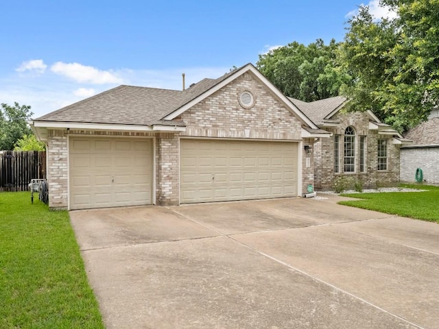 2520 Butler National Dr, Pflugerville, TX 78660 - view of front of home featuring driveway, a shingled roof, and brick siding