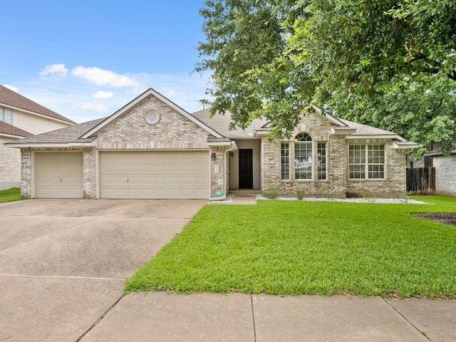 2520 Butler National Dr, Pflugerville, TX 78660 - view of front facade with a garage, brick siding, concrete driveway, a front yard, and roof with shingles