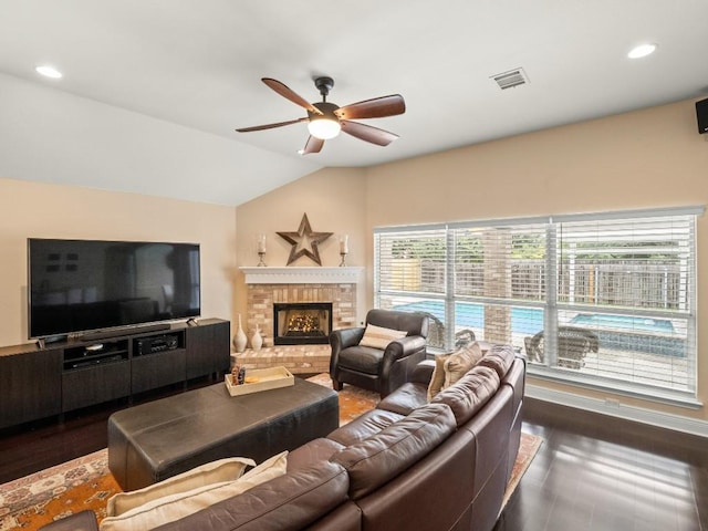 2520 Butler National Dr, Pflugerville, TX 78660 - living area featuring ceiling fan, vaulted ceiling, a fireplace, and recessed lighting